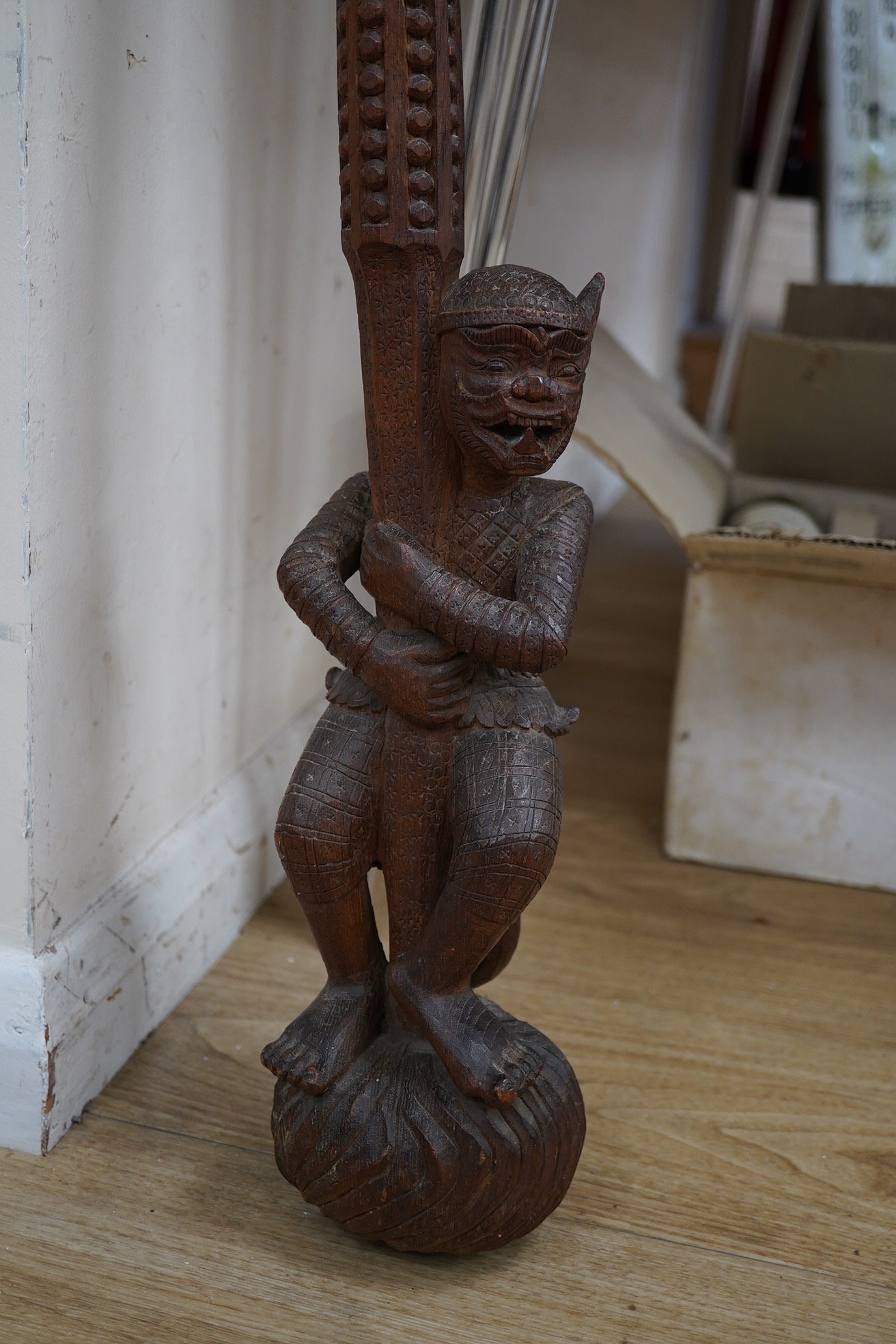 An Indonesian chip-carved ‘Hanuman’ staff, 130cm. Condition - fair to good